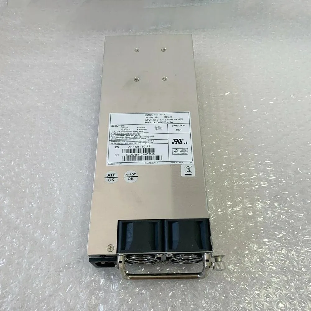 Silver rectangular ATX power supply unit with ventilation grille and fan visible