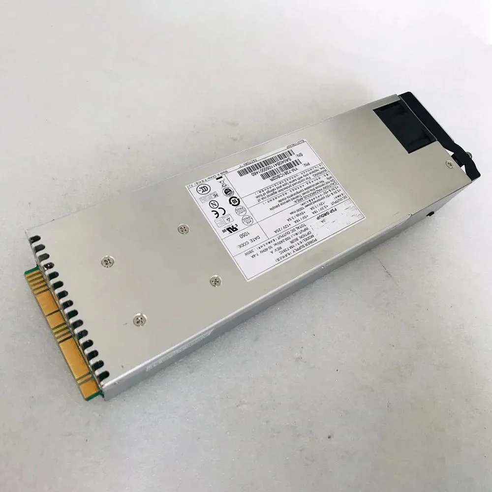 Silver rectangular ATX redundant power supply unit with model label YM-7381C