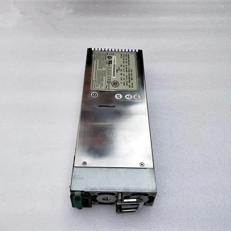 Rectangular silver ATX power supply unit with fan grille