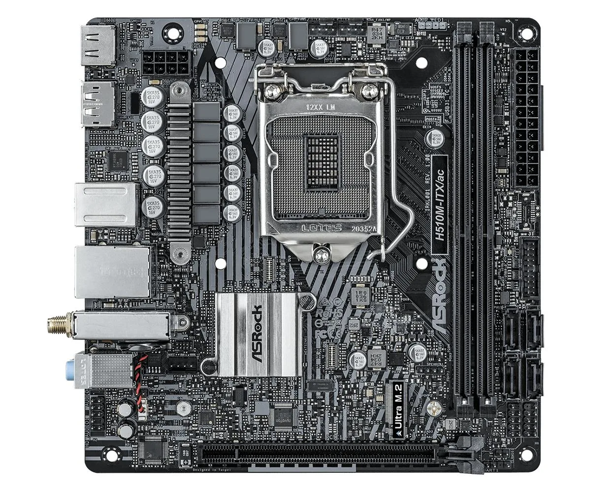 Green Mini-ITX board with silver CPU socket, two black RAM slots, blue PCIe slot, rear I/O shield and vertical Wi-Fi module