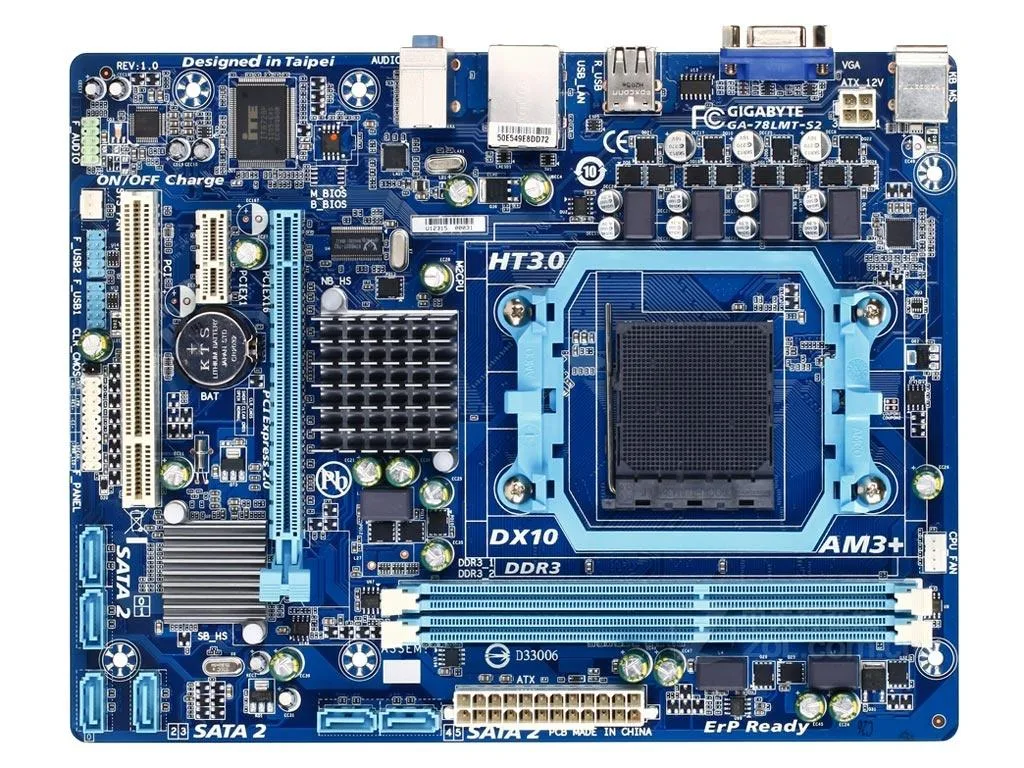 Green Micro ATX motherboard with black sockets and silver heatsinks