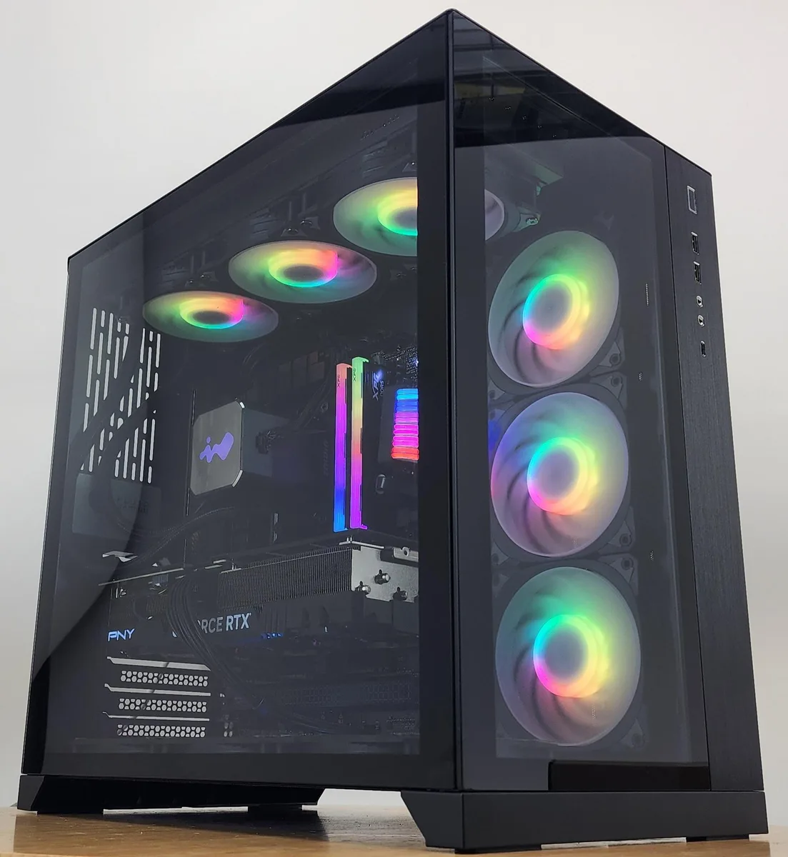 Black Lian Li O11 Dynamic case with 360mm AIO RGB cooler visible through glass panel