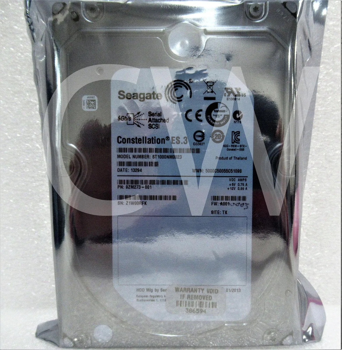 Silver 3.5 inch bare hard drive with circuit board visible