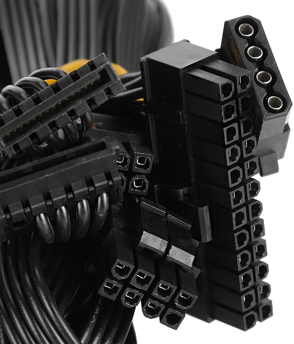 Rectangular ATX power supply in black metal finish with a 14cm fan grille and labelled cable connectors visible