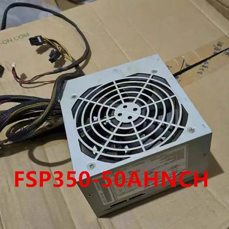 A silver rectangular ATX power supply unit with a black cooling fan grille and visible ventilation slots