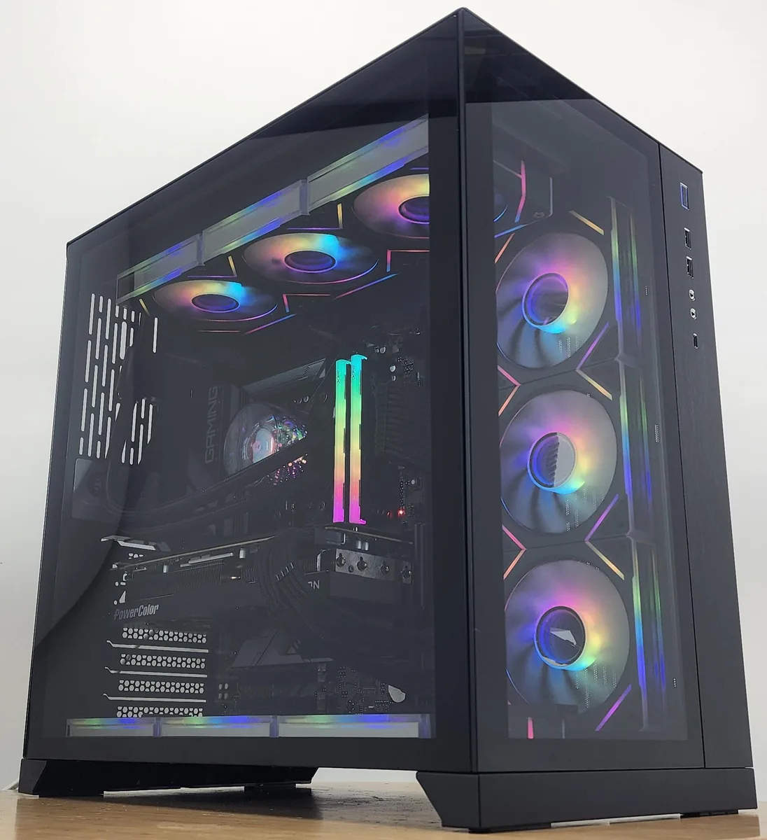 Black Lian Li O11 Dynamic ATX case with 360mm AIO RGB cooler visible through tempered glass panels