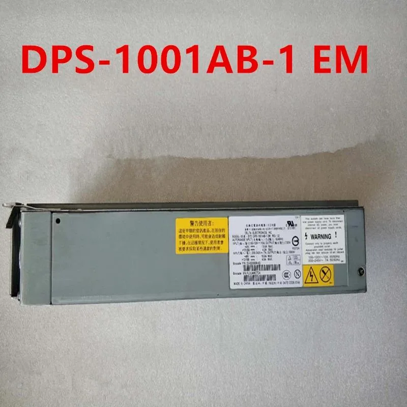 Rectangular silver metal power supply unit with ventilation grilles and rear connector panel