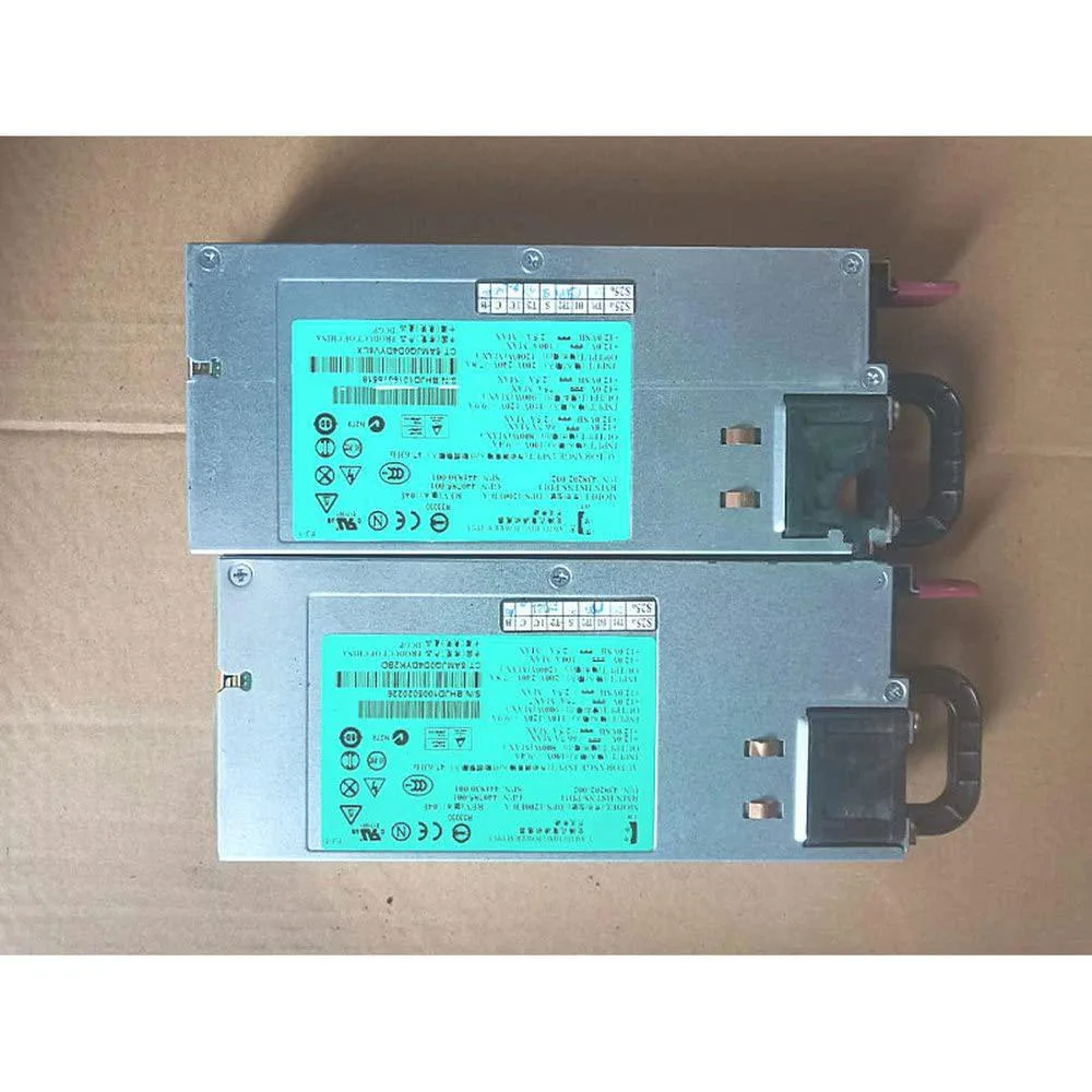 Rectangular silver server power supply unit with ventilation grille and rear connector panel