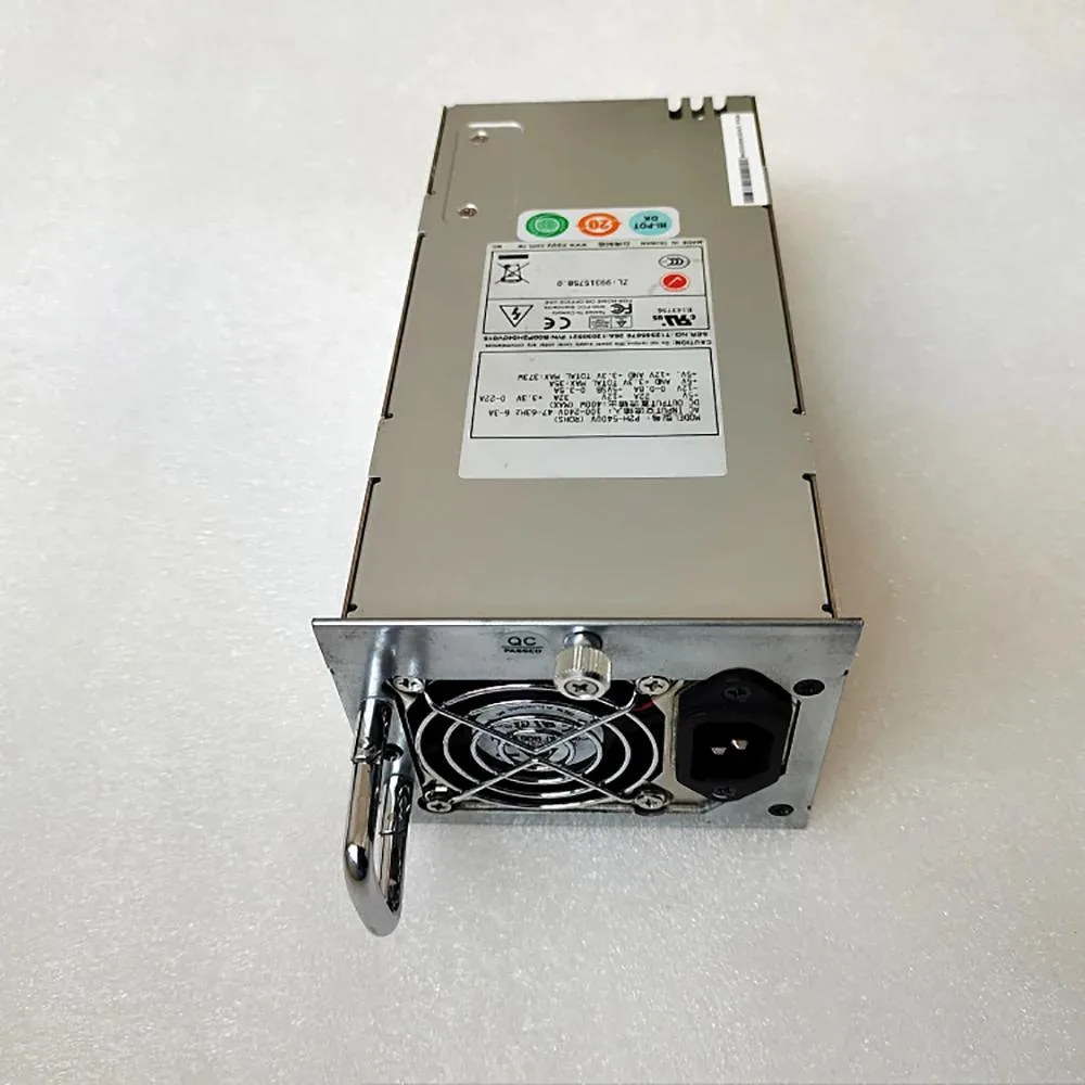 Rectangular metal ATX power supply unit with fan grille and cable bundle