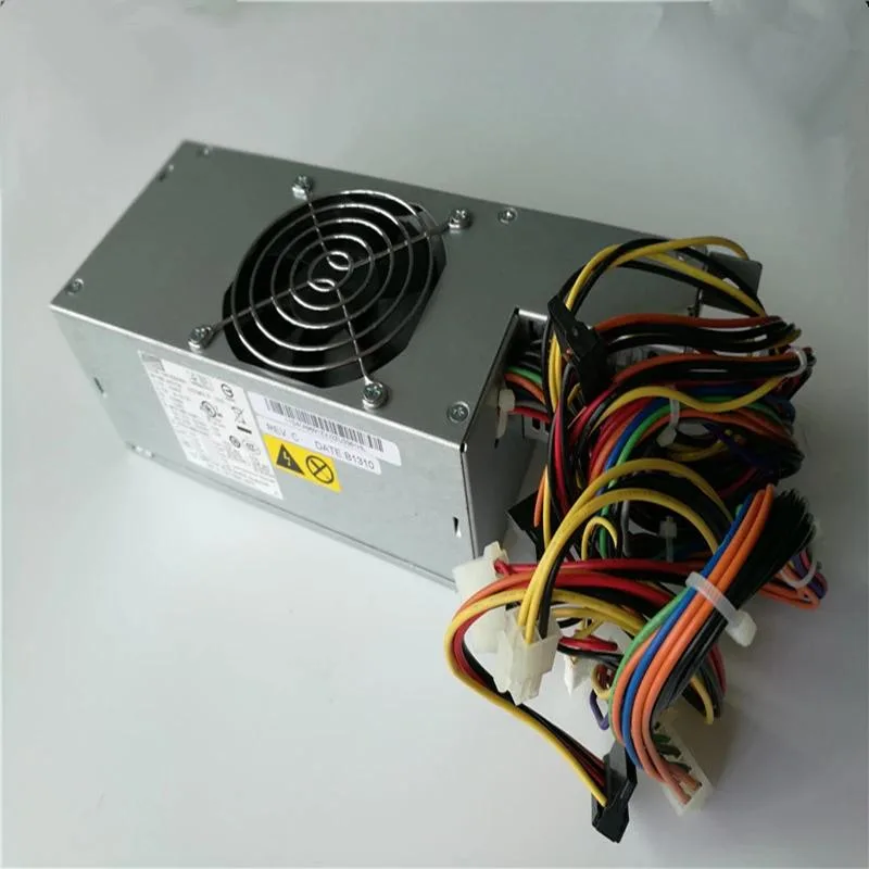 Rectangular ATX power supply unit, matte black metal casing, cooling fan visible on one side, power socket and switch on rear