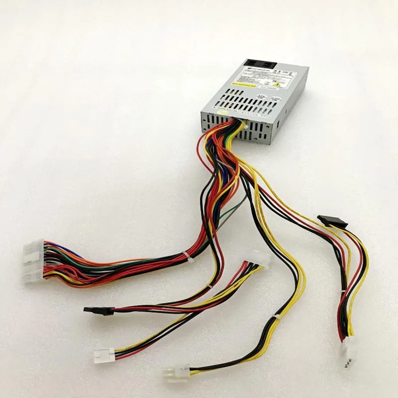 Compact silver metal power supply unit with fan grille and power socket visible