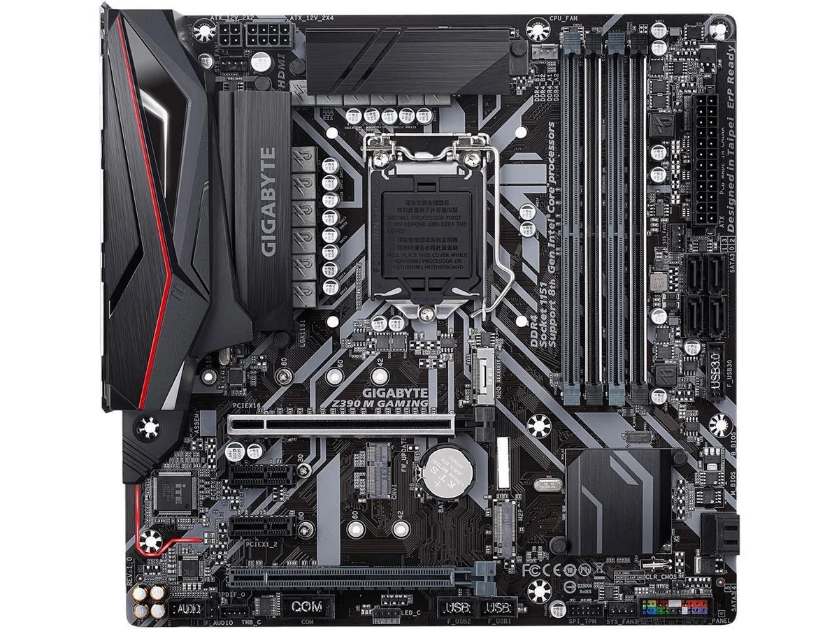 Micro-ATX motherboard, black PCB, silver heatsinks, integrated I/O shield