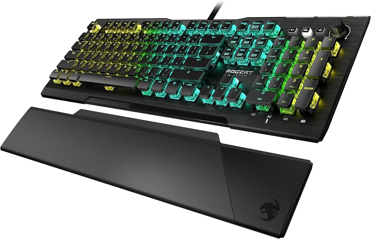 Full-size black gaming keyboard with anodized aluminum top plate, low-profile keys, volume dial, and detachable magnetic palm rest