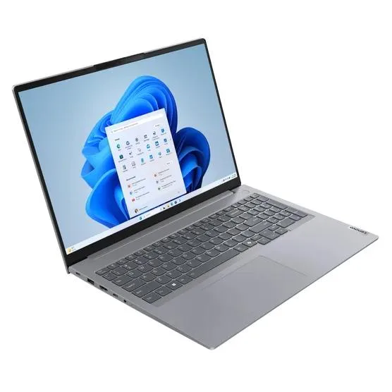 Silver aluminium 16 inch touchscreen laptop open showing keyboard and trackpad