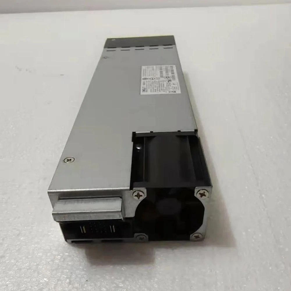 Black rectangular power supply unit with ventilation grilles and label showing 1100W for 3850 series switches
