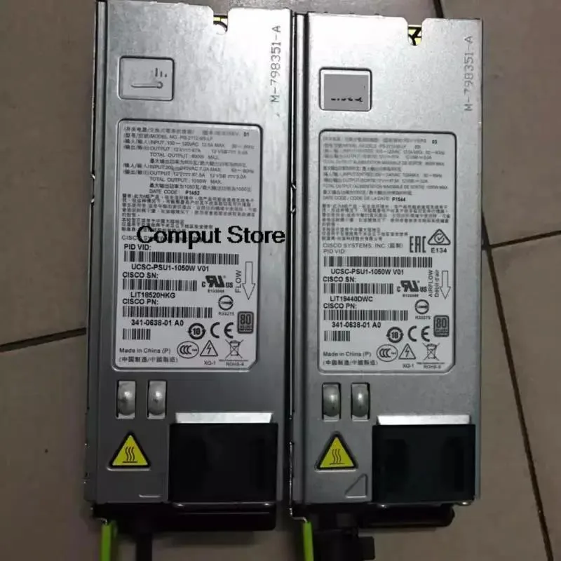 Silver rectangular server power supply unit with front grille and label