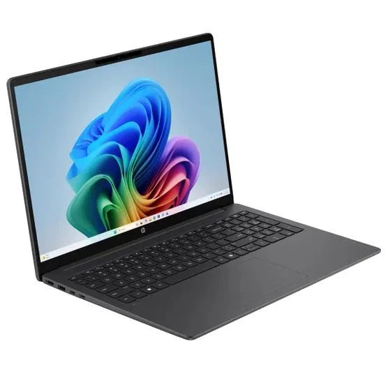 Silver 16-inch touchscreen laptop with backlit keyboard and numeric keypad