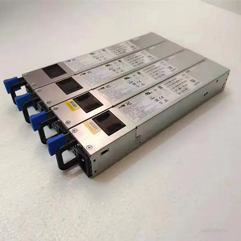 Silver ATX power supply unit with black cooling fan visible through rear grille