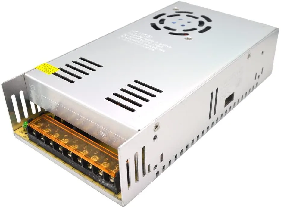 Rectangular metal AT power supply unit, 21.5 by 11.5 by 5 centimetres, silver finish, indoor use only