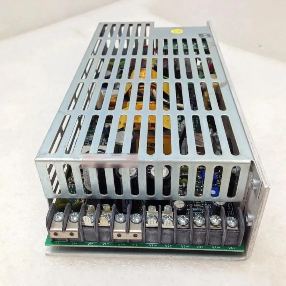 Rectangular metal ATX power supply unit with ventilation grille and label