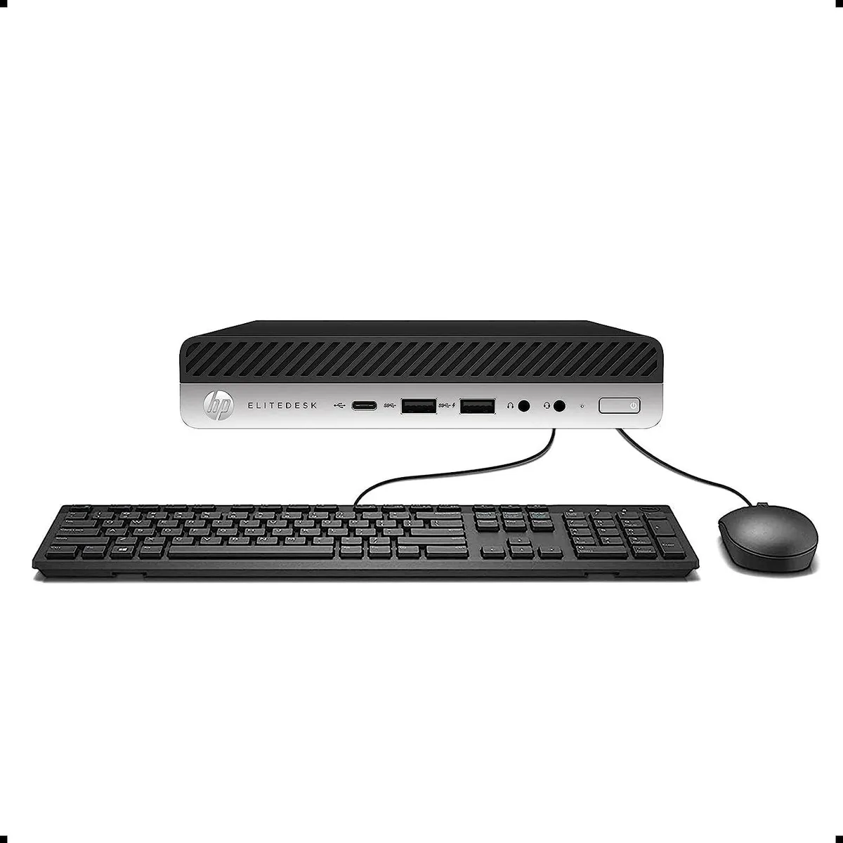 Small black square desktop mini PC on a plain background