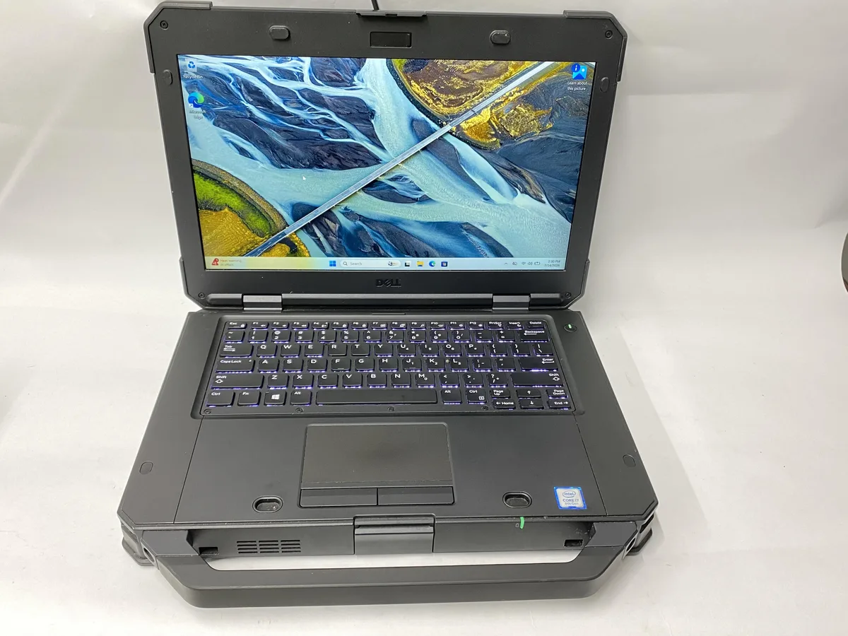 Grey Dell Latitude 5424 laptop closed on plain background
