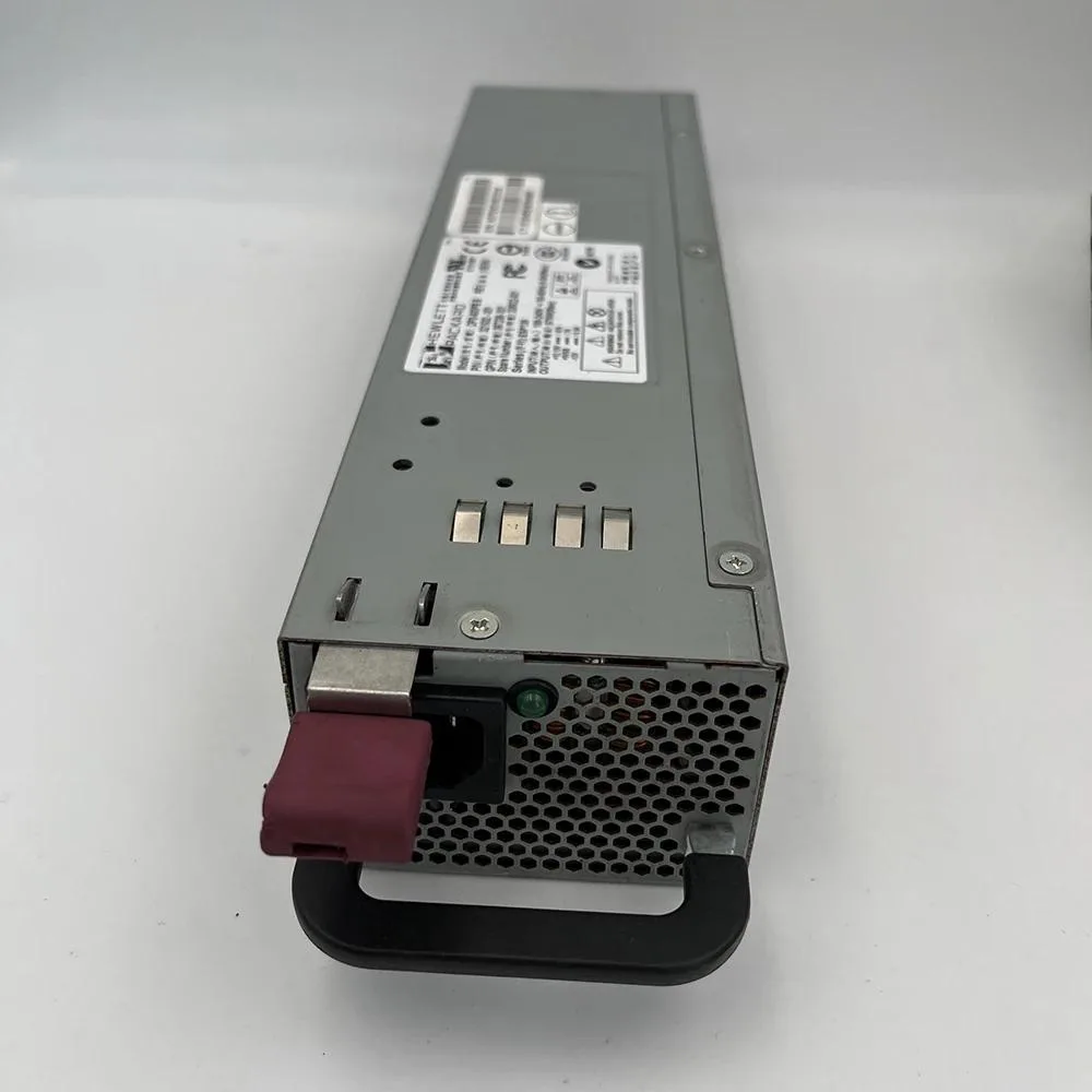 Rectangular metal server power supply unit with rear fan grille and power connector