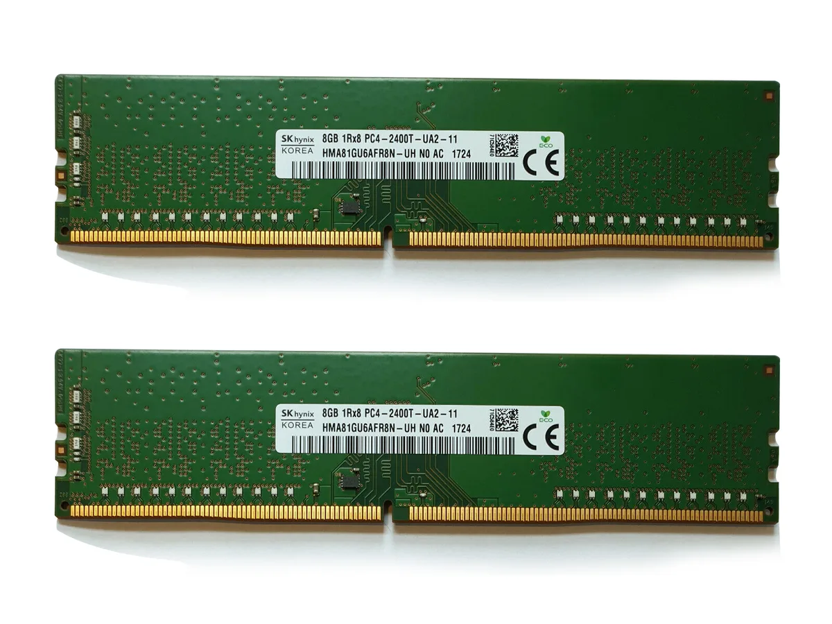 Two green DDR4 DIMM sticks with black chips and gold contacts