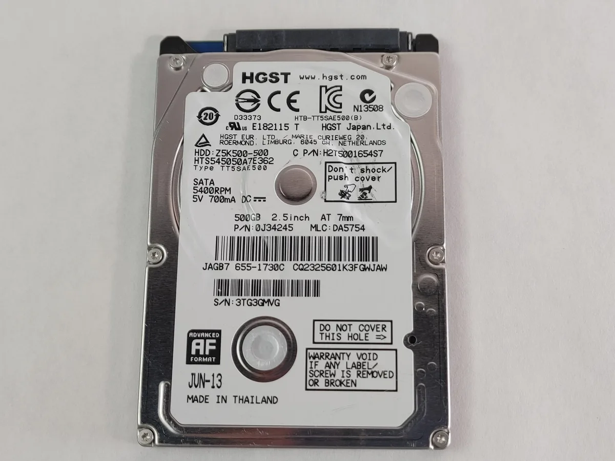 Silver 2.5 inch SATA hard drive with circuit board visible