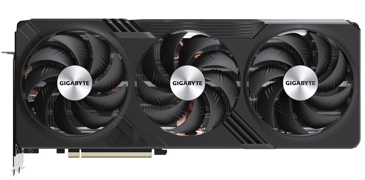 Large triple-fan graphics card with silver shroud and black accents, three-slot ATX form factor