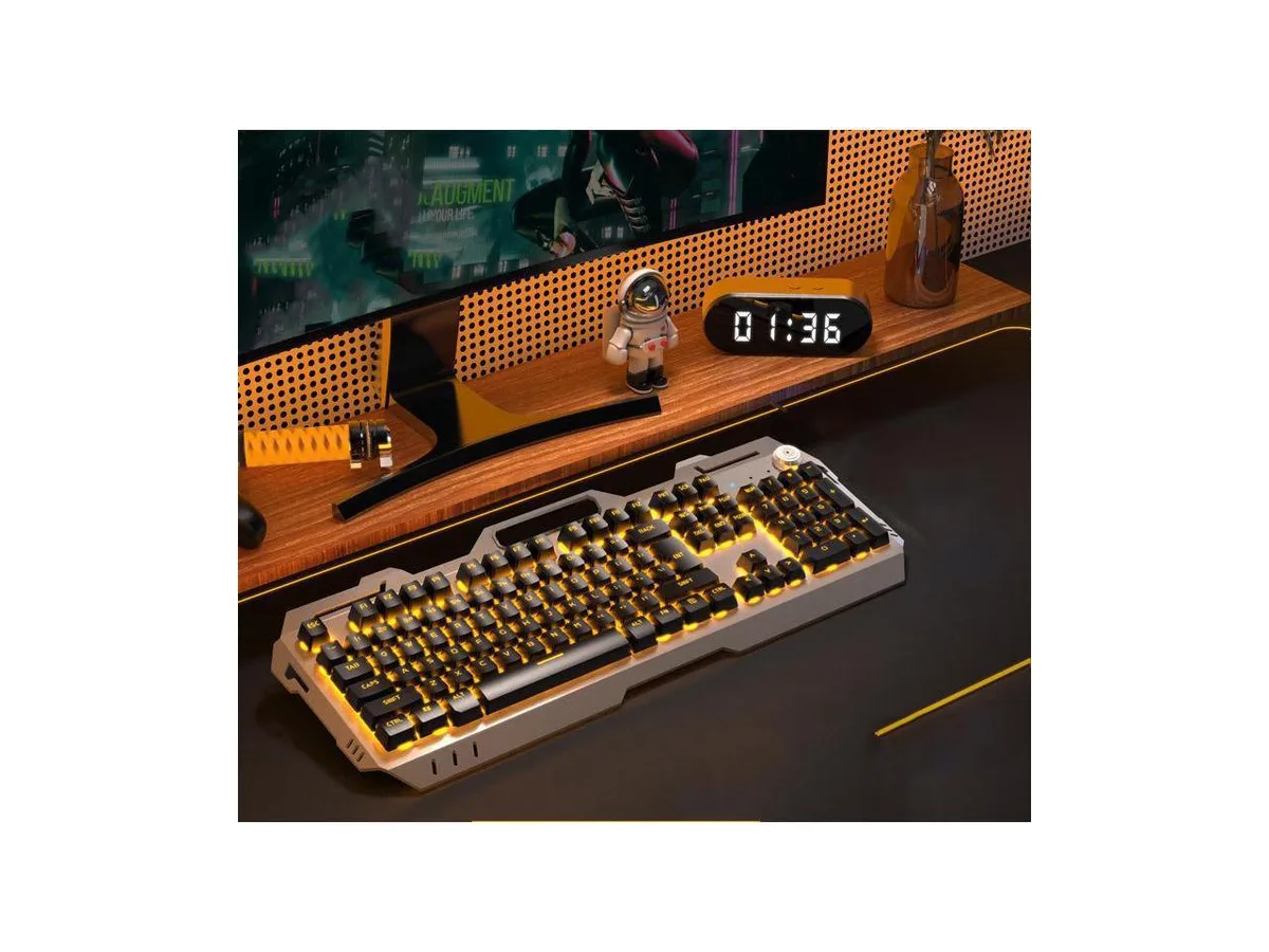 Black wired keyboard with champagne metal panel and matching mouse with orange backlighting