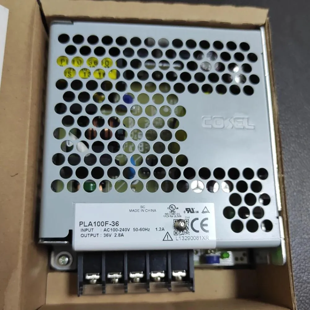 Rectangular metal power supply unit with label showing 36V 2.8A output
