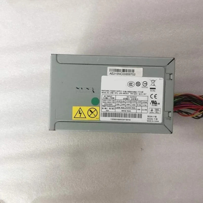 Silver rectangular ATX power supply unit with cooling fan grille