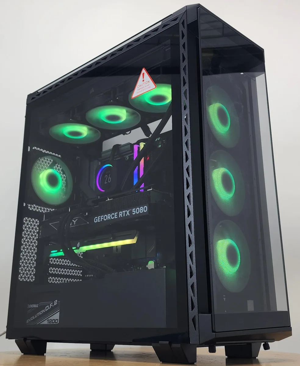 Black mid-tower gaming desktop with tempered glass side panel and visible RGB lighting inside