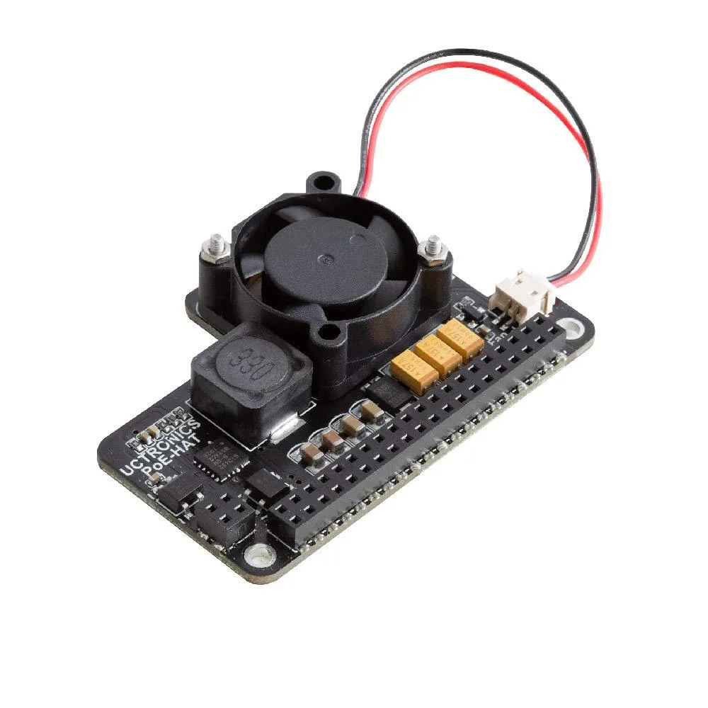 Green circuit board with black cooling fan and Ethernet port