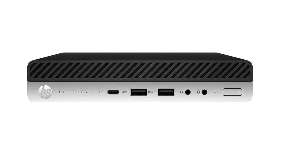 Compact black mini desktop with keyboard and mouse