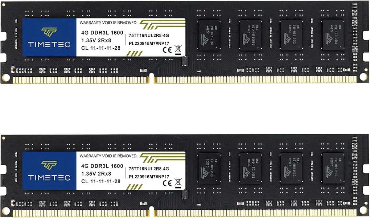 Two black rectangular memory modules with gold edge connectors on a plain background