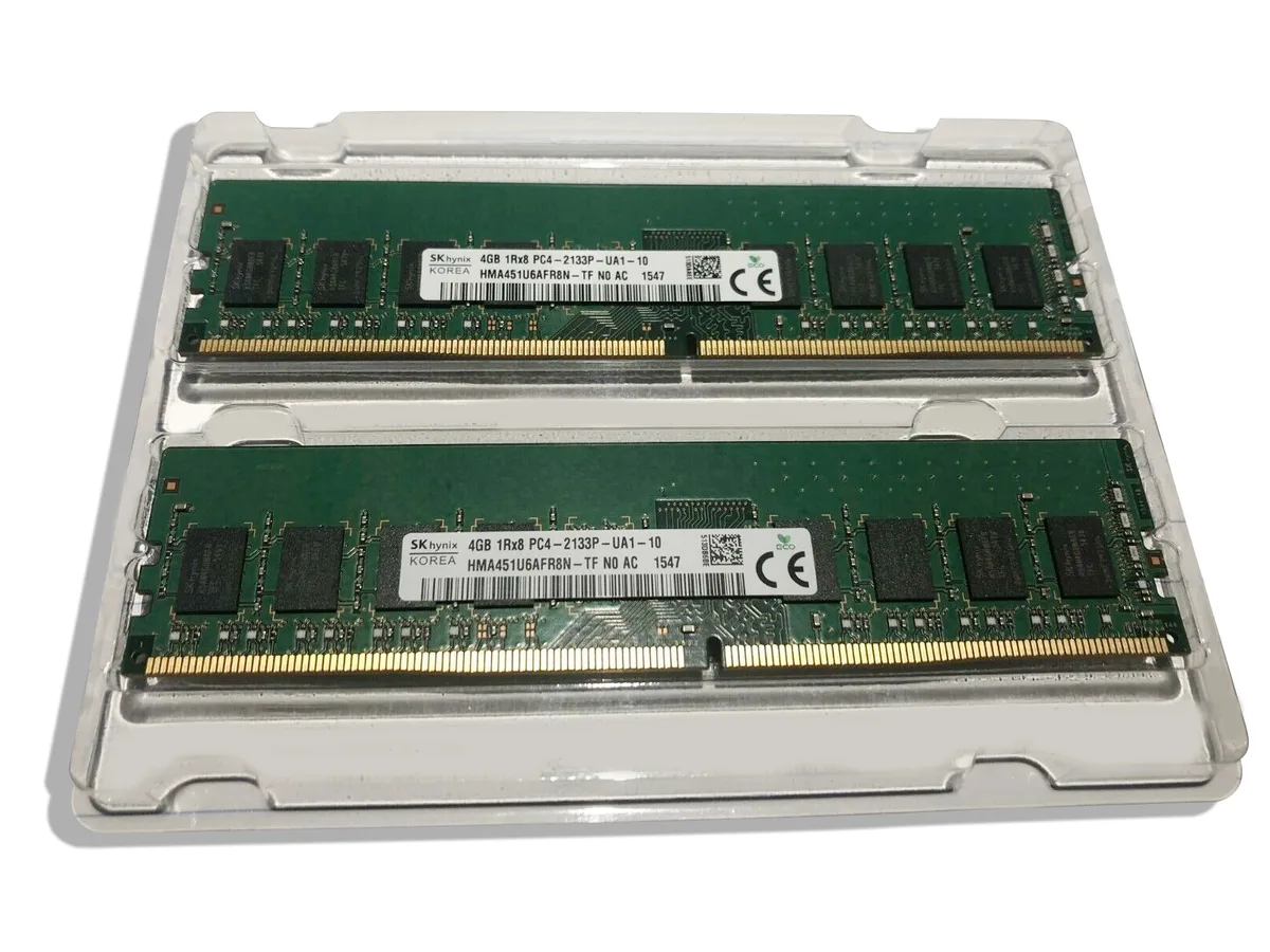 Two green DDR4 DIMM sticks with black chips and gold contacts