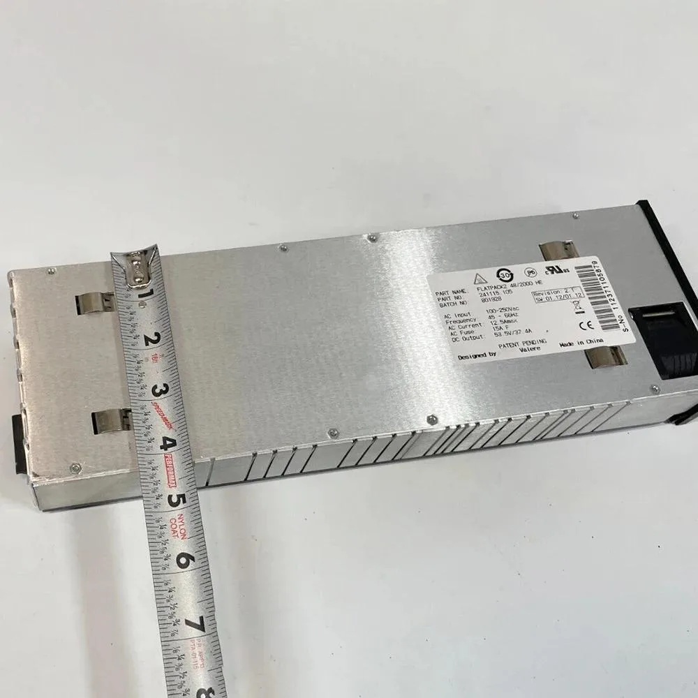 Rectangular silver power supply module with front handle and ventilation slots