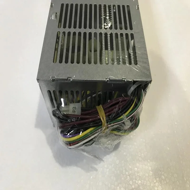 Small form factor desktop power supply unit in black metal casing with cooling fan grille and cable connectors visible
