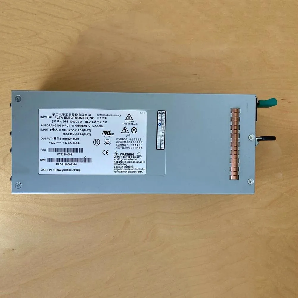 Rectangular silver server power supply unit with ventilation grille and label DPS-1000DB A D73299-005 -008 1050W B300