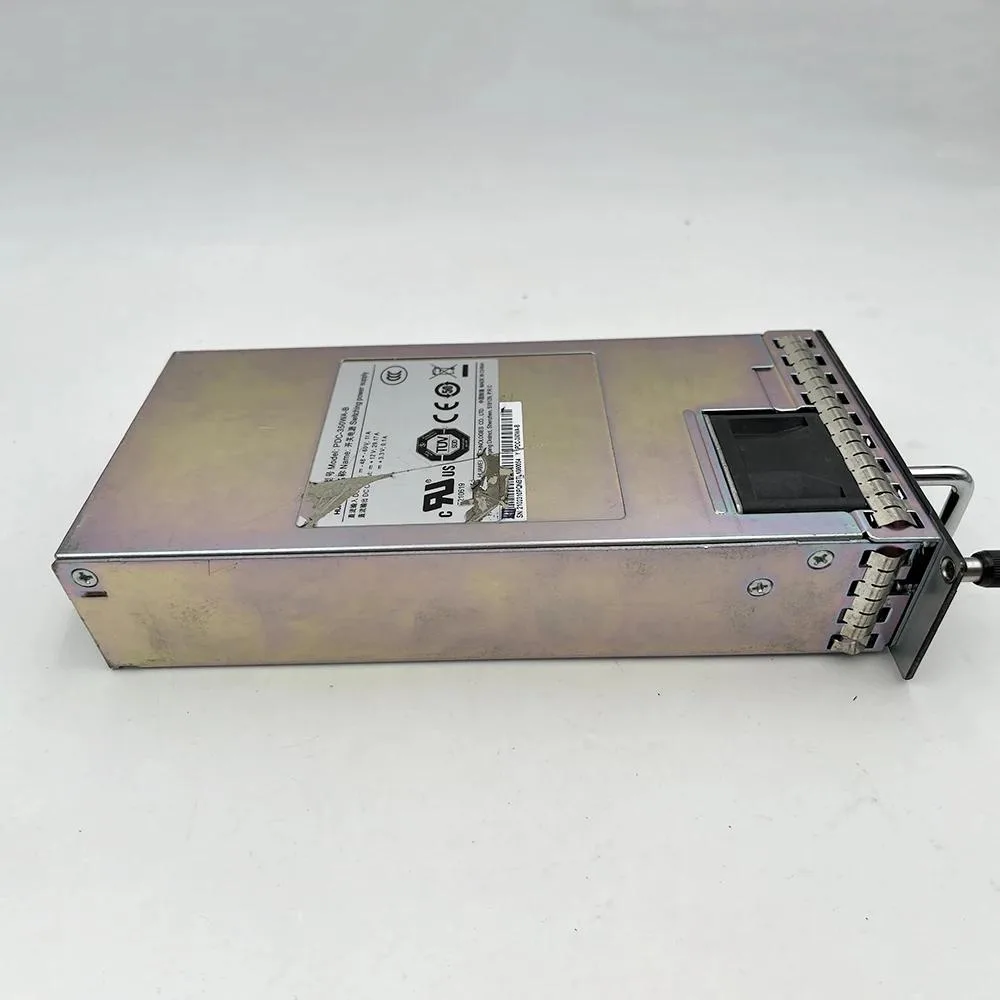 Rectangular silver ATX power supply unit with ventilation grille and rear power socket