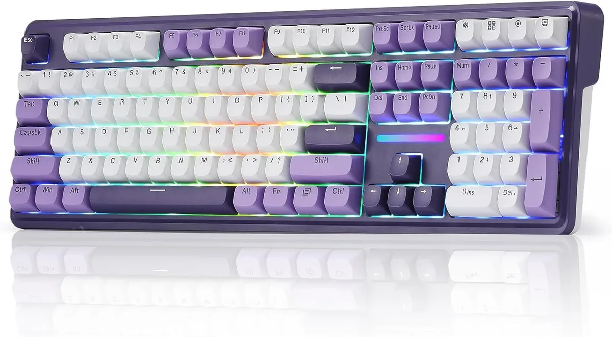 Purple full-size mechanical keyboard with translucent round keycaps and RGB lighting