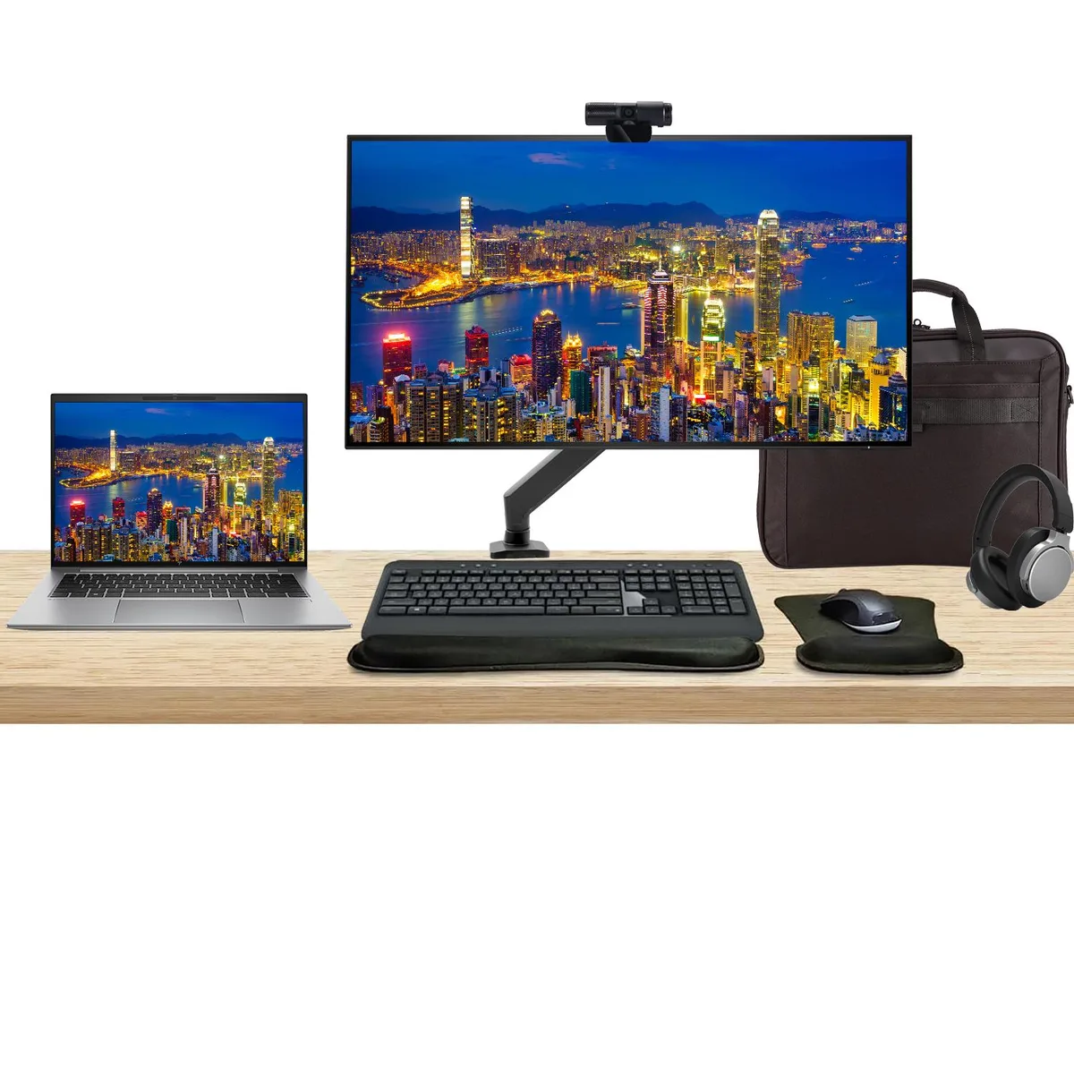 Silver 14 inch laptop beside 32 inch 4K monitor with desk mount keyboard mouse webcam headphones bag