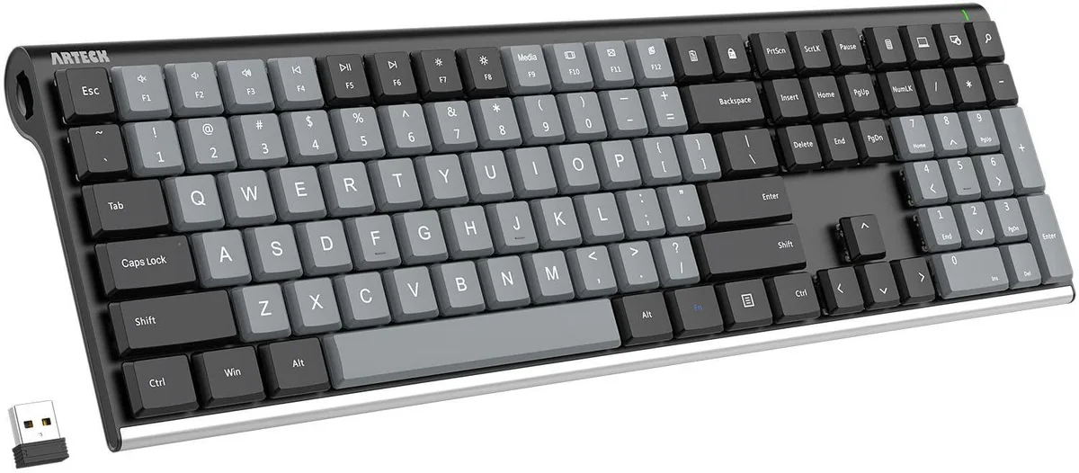 Full-size black mechanical keyboard with stainless steel back and low-profile tactile brown switches
