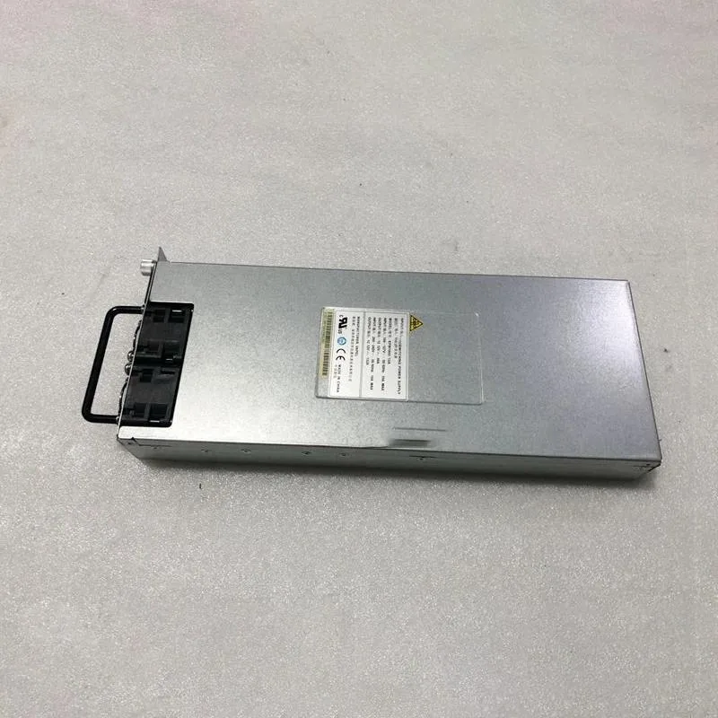 Redundant server power supply unit, silver metal enclosure with black cooling fan and gold edge connector