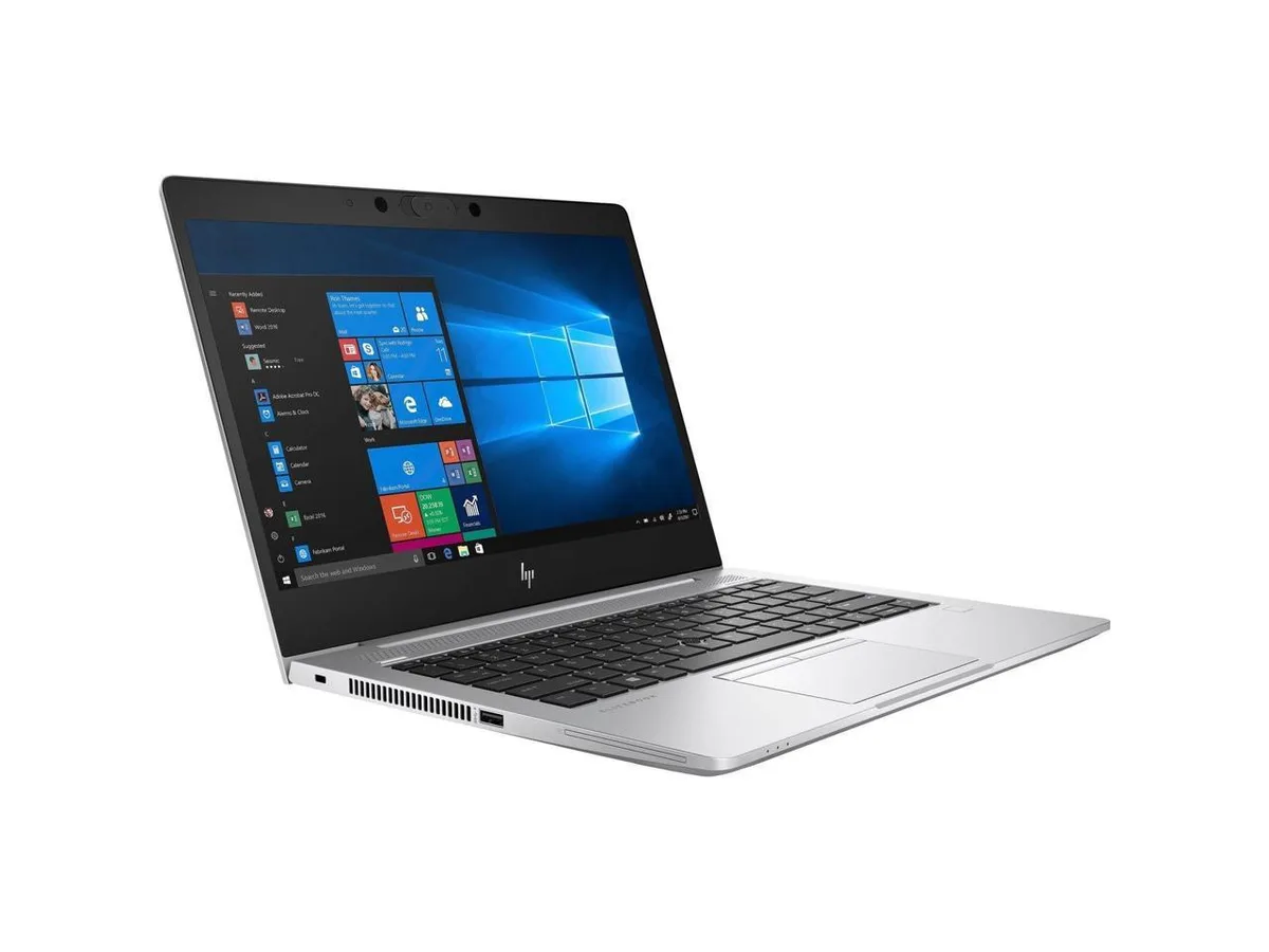 Silver 13.3 inch convertible laptop with touchscreen display and 360 degree hinge