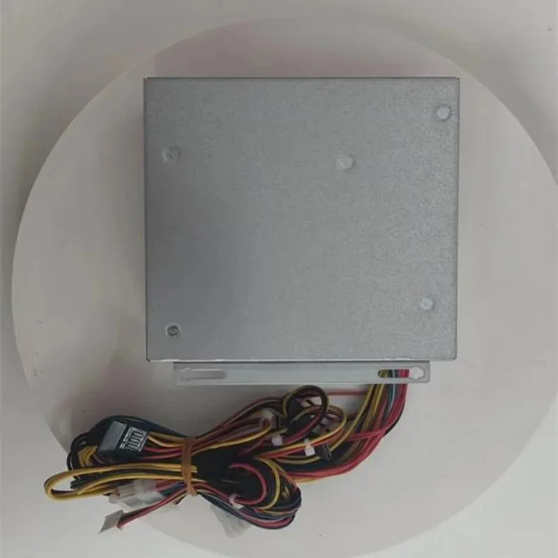 Silver ATX power supply unit with fan grille and cable bundle