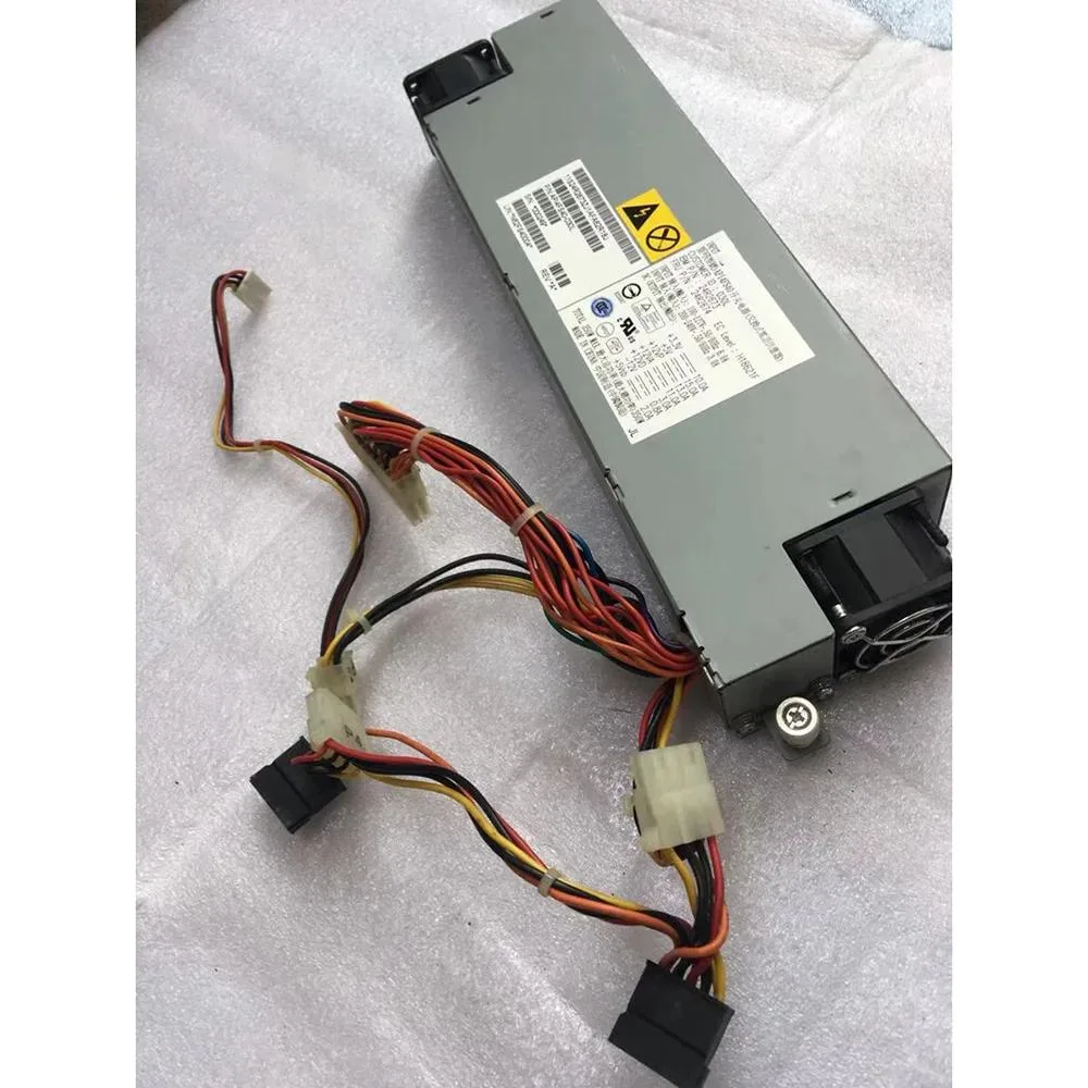 Rectangular metal ATX power supply unit with rear fan grille and power socket