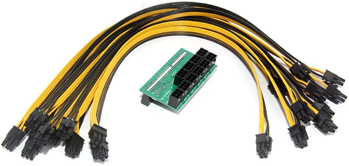 Green breakout board with ten black 6-pin cables attached